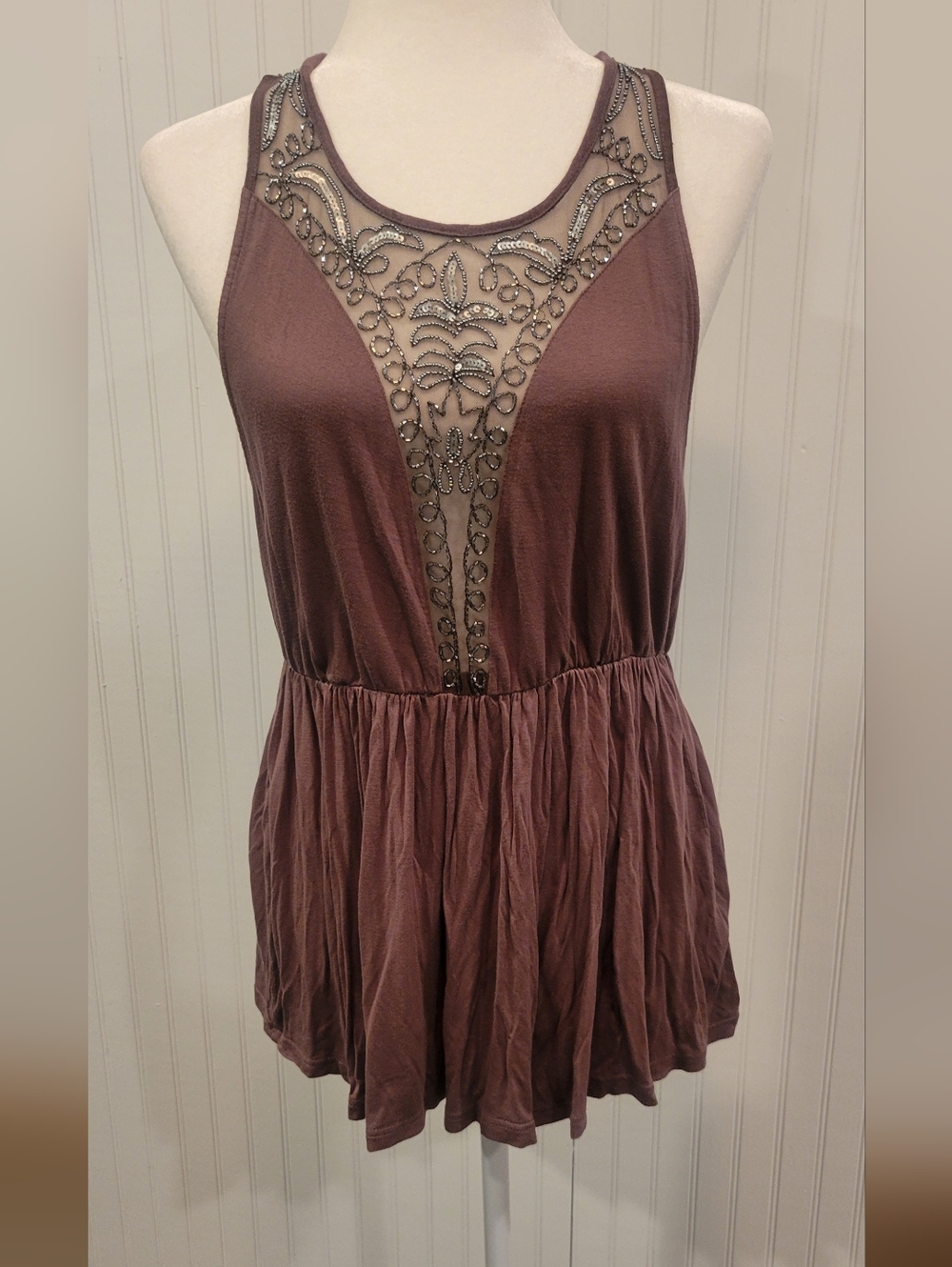 Lg Bke Boutique Beaded Mesh Tank Top With A Sinched Waist And A Racer Back.